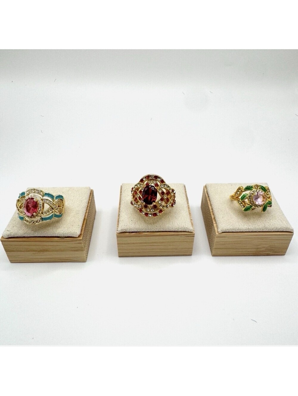 Gold tone statement ring lot with one central CZ stones and ornate accent stones